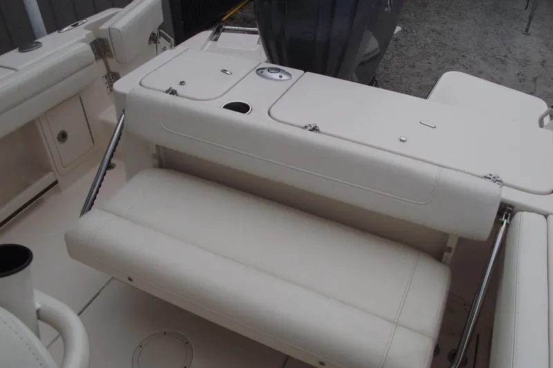 Slide: The Image of 2023 Grady-White Fisherman 236 boat interior with cushioned seating and storage compartments. - 25