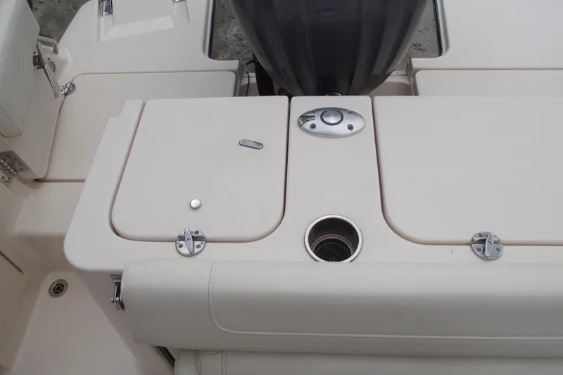Slide: The Image of 2023 Grady-White Fisherman 236 boat deck with storage compartments and cup holder. - 26