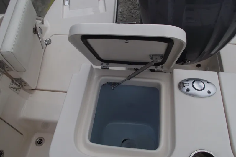 Slide: The Image of 2023 Grady-White Fisherman 236 boat with open storage compartment and seating area. - 27