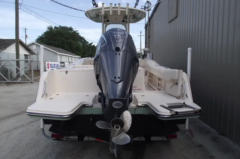 Slide: The Image of 2023 Grady-White Fisherman 236 boat with powerful outboard motor, parked outdoors. - 3