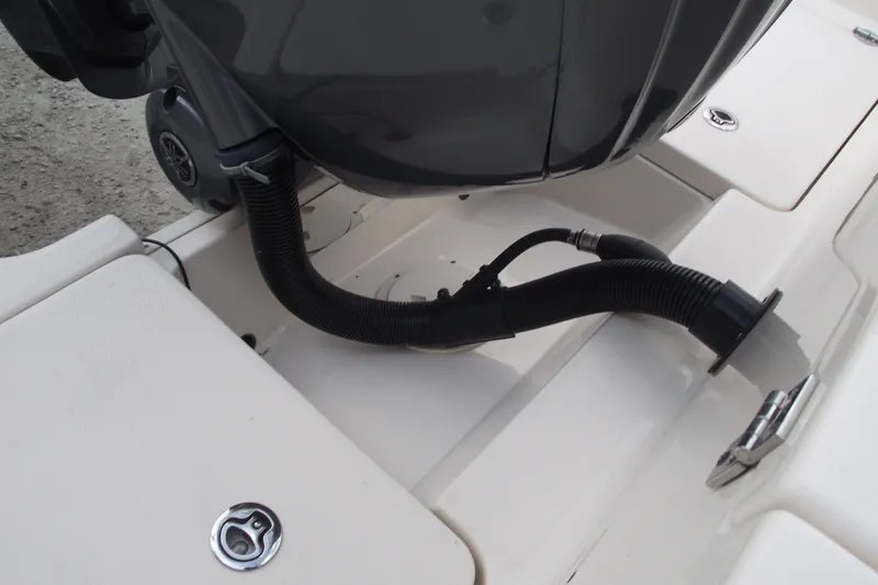 Slide: The Image of 2023 Grady-White Fisherman 236 boat engine compartment with hose and fittings. - 31