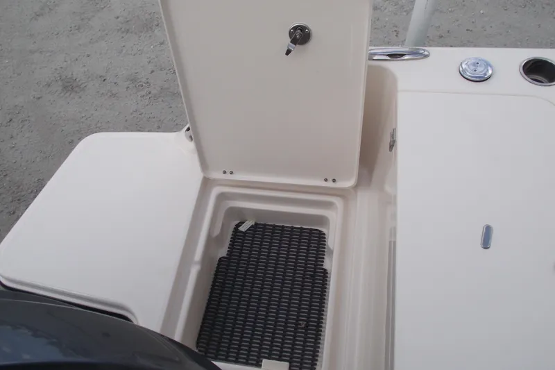 Slide: The Image of 2023 Grady-White Fisherman 236 boat storage compartment with open hatch and black mat. - 33