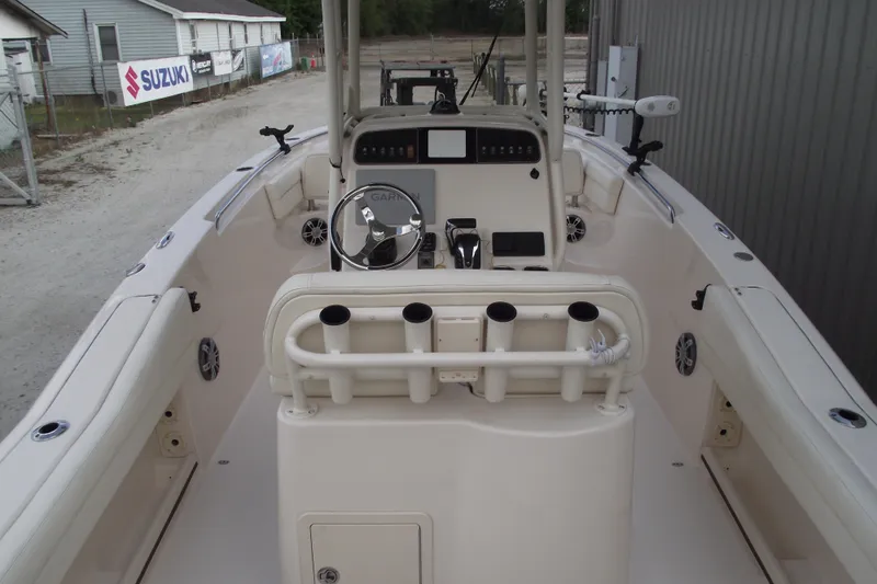 Slide: The Image of 2023 Grady-White Fisherman 236 boat interior with steering console and rod holders. - 34