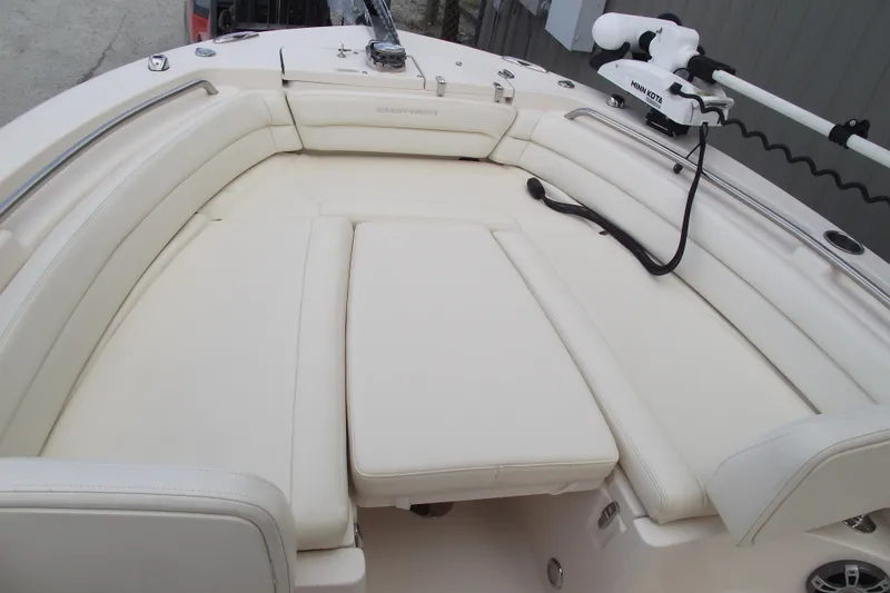 Slide: The Image of 2023 Grady-White Fisherman 236 boat interior with cushioned seating and fishing equipment. - 5