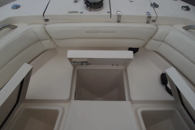 Slide: The Image of 2023 Grady-White Fisherman 236 boat interior with storage compartments and seating. - 9