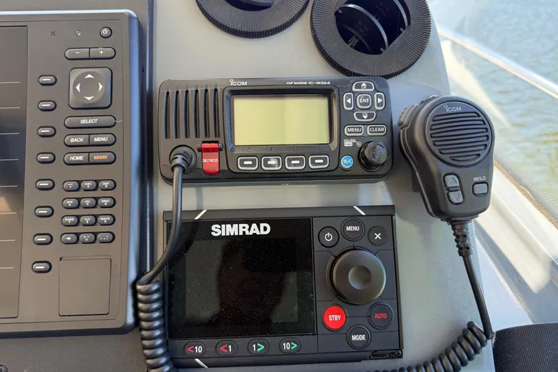 Slide: The Image of Control panel of a 2001 Tiara Yachts 5200 Express with Icom and Simrad equipment. - 10