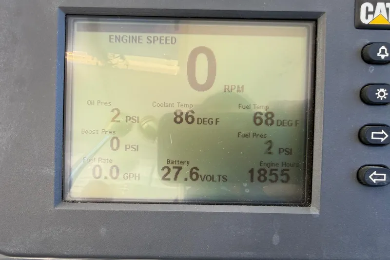 Slide: The Image of Dashboard of a 2001 Tiara Yachts 5200 Express showing engine metrics and status. - 12