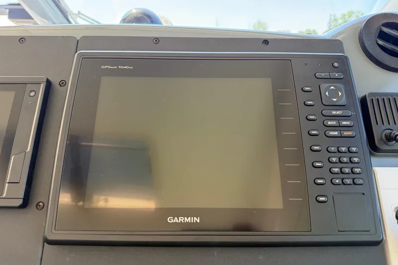 Slide: The Image of Garmin GPSMAP 1040xs on 2001 Tiara Yachts 5200 Express dashboard. - 14