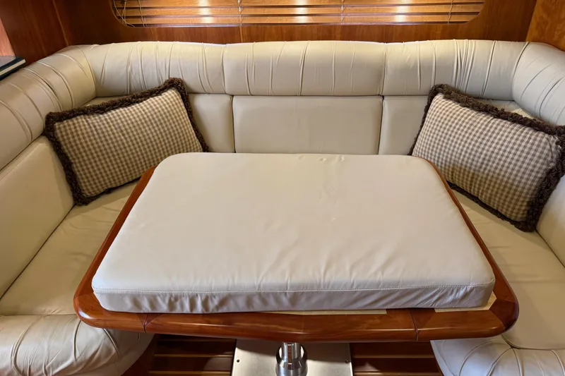 Slide: The Image of Luxurious interior of 2001 Tiara Yachts 5200 Express with plush seating and cushions. - 20
