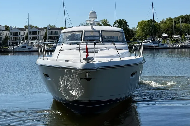 Slide: The Image of Front view of a 2001 Tiara Yachts 5200 Express on calm water. - 3