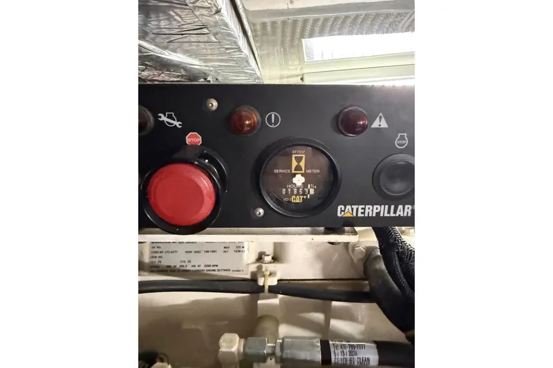 Slide: The Image of Control panel of a 2001 Tiara Yachts 5200 Express with Caterpillar engine display. - 43