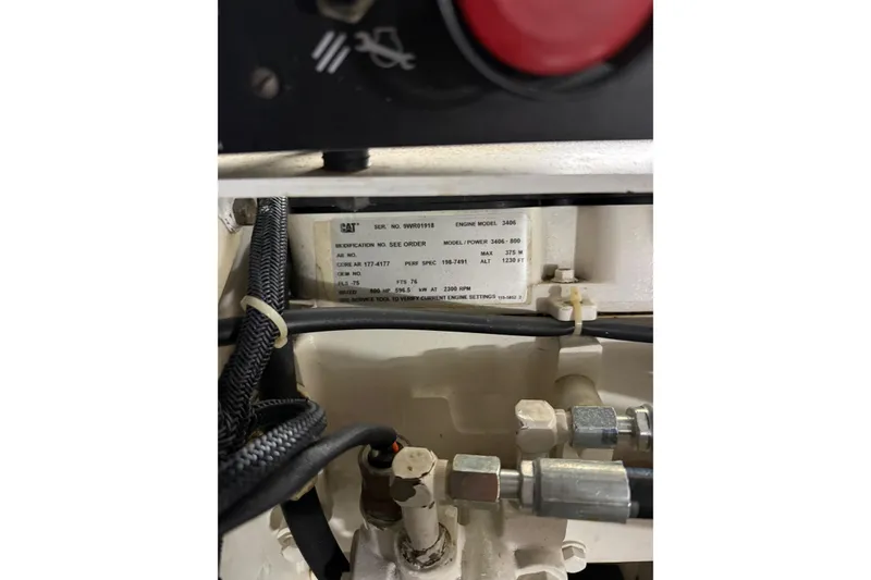 Slide: The Image of Engine compartment of a 2001 Tiara Yachts 5200 Express, featuring CAT engine model 3406. - 44