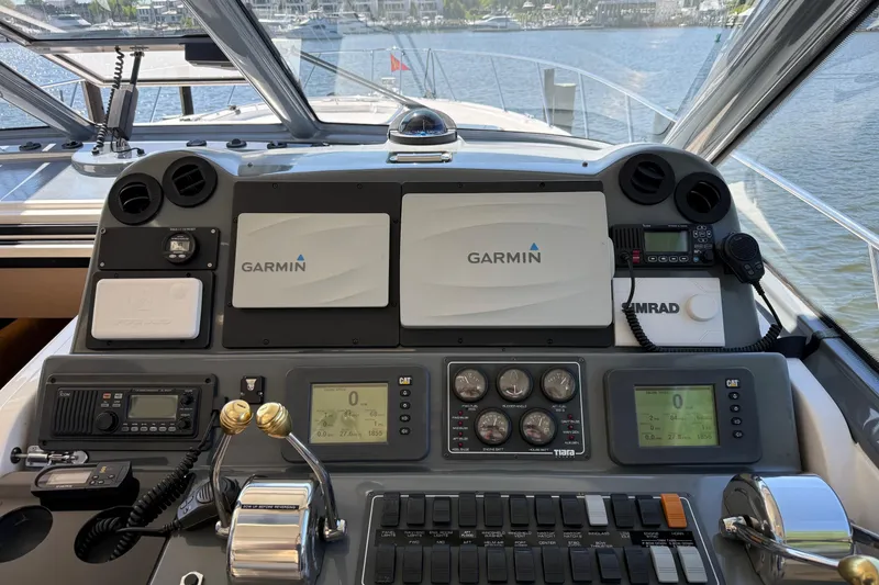 Slide: The Image of Helm of 2001 Tiara Yachts 5200 Express with Garmin navigation systems and controls. - 8
