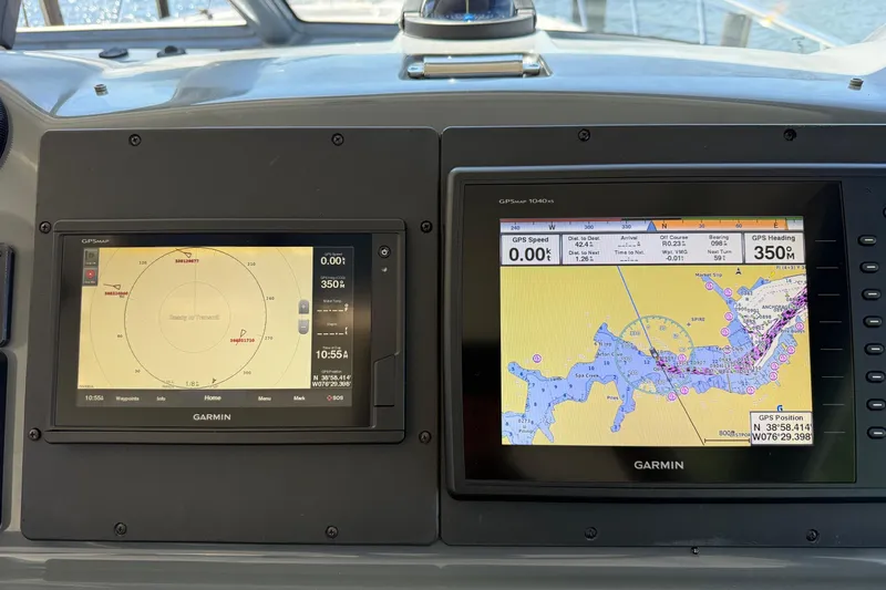 Slide: The Image of Garmin navigation screens on a 2001 Tiara Yachts 5200 Express boat dashboard. - 9