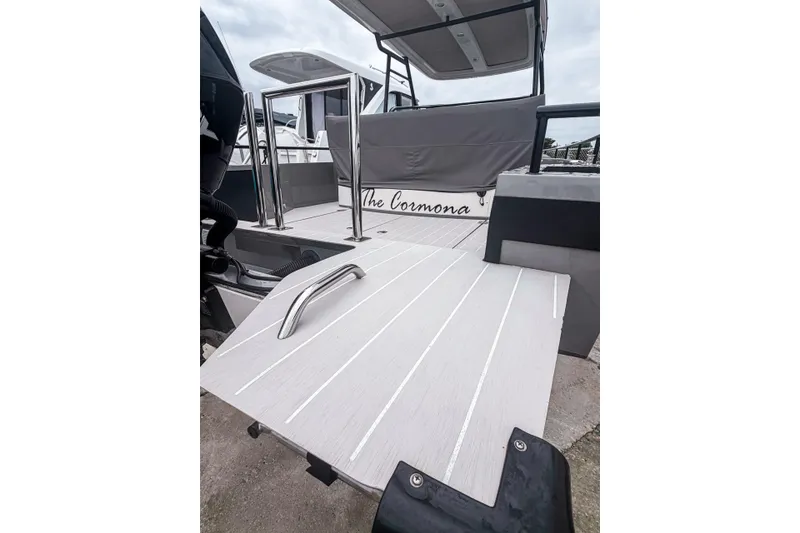 Slide: The Image of 2017 Axopar 28 T-Top boat with sleek deck design and modern features. - 15