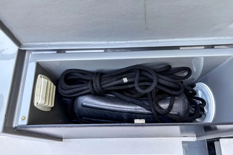 Slide: The Image of Storage compartment on a 2017 Axopar 28 T-Top boat with rope and fender. - 18