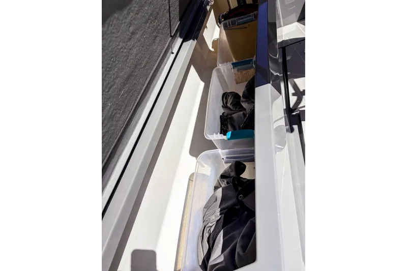 Slide: The Image of Storage compartments on a 2017 Axopar 28 T-Top boat with organized gear. - 20