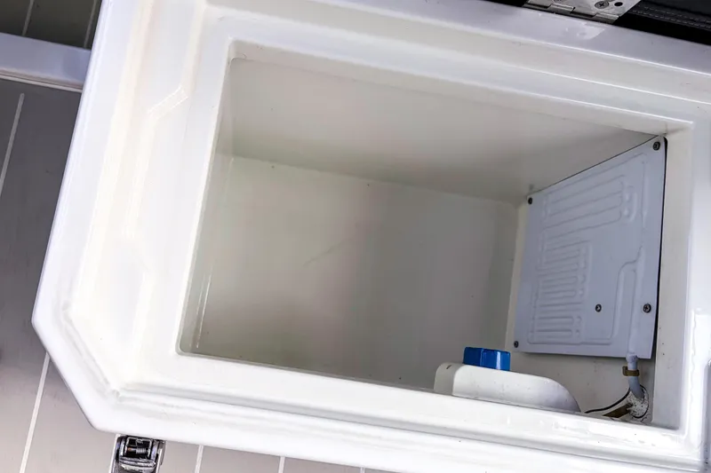 Slide: The Image of Interior view of a 2017 Axopar 28 T-Top boat compartment. - 21