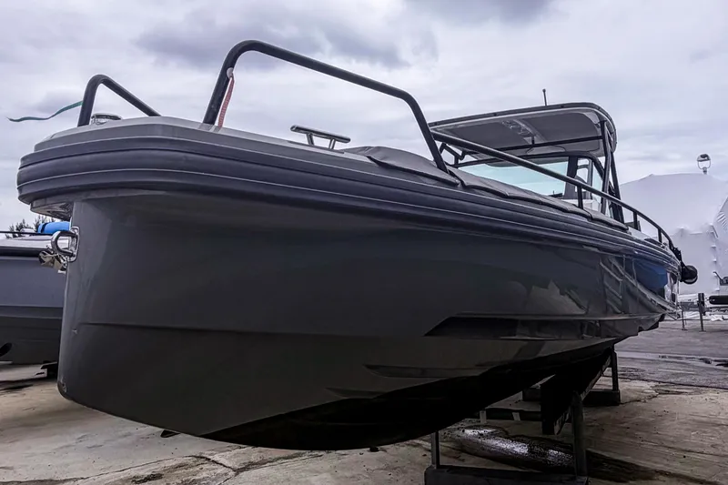 Slide: The Image of 2017 Axopar 28 T-Top boat on display, showcasing sleek design and modern features. - 3