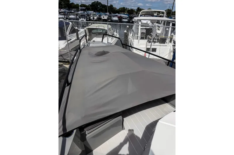 Slide: The Image of Manuals and documents for 2017 Axopar 28 T-Top, including Garmin and Mercury guides. - 30