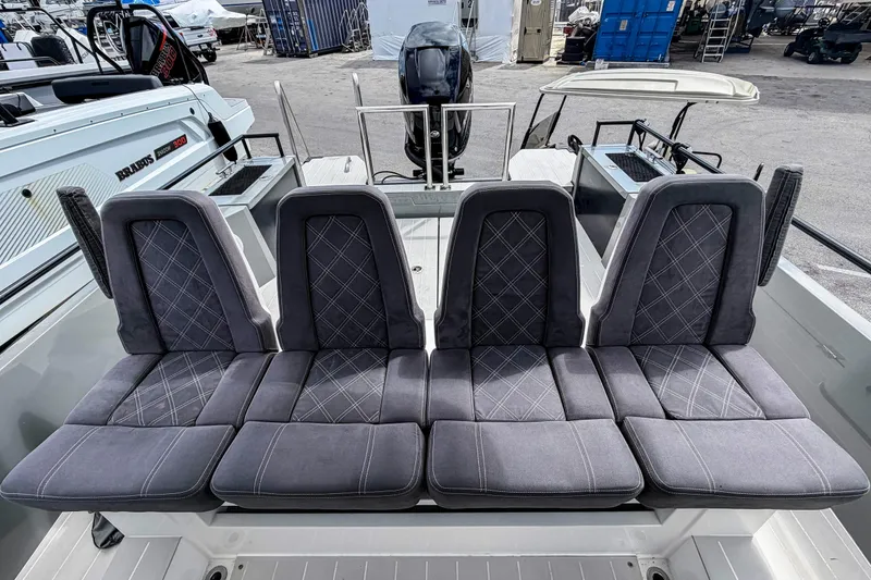 Slide: The Image of 2017 Axopar 28 T-Top boat with stylish gray seating and modern design. - 7
