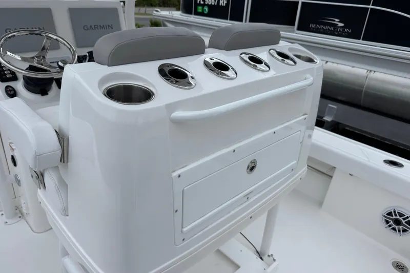 Slide: The Image of 2026 Caymas 26 HB boat console with cup holders and Garmin electronics. - 10