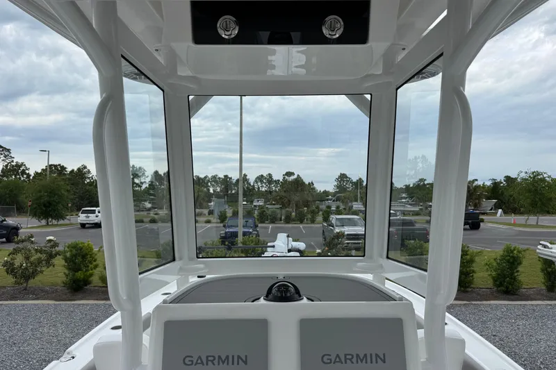 Slide: The Image of Interior view of 2026 Caymas 26 HB boat with Garmin navigation system. - 13