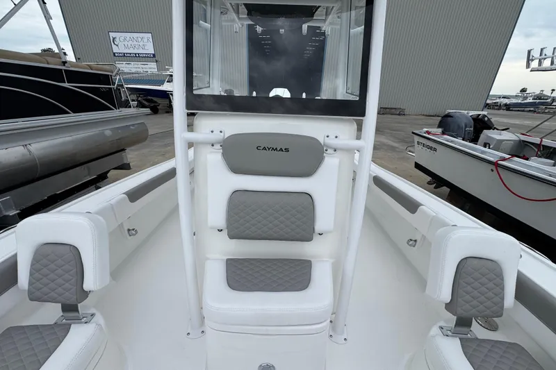 Slide: The Image of 2026 Caymas 26 HB boat interior with cushioned seating and modern design at Grander Marine. - 20