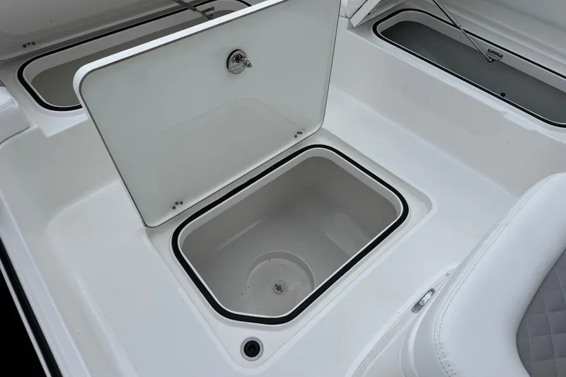 Slide: The Image of Open storage compartment on 2026 Caymas 26 HB boat, showcasing interior design. - 28