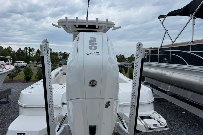 Slide: The Image of 2026 Caymas 26 HB boat with powerful 350 V10 engine, displayed outdoors. - 6