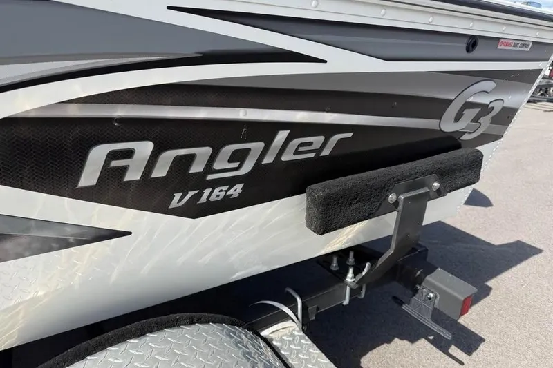 Slide: The Image of 2022 G3 Angler V164 C boat on trailer, close-up view. - 12