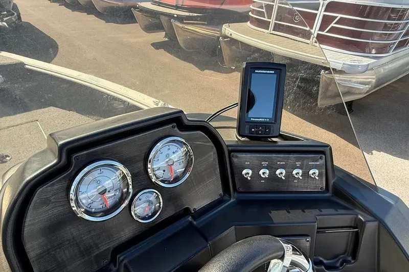 Slide: The Image of 2022 G3 Angler V164 C dashboard with gauges and Humminbird fish finder. - 6