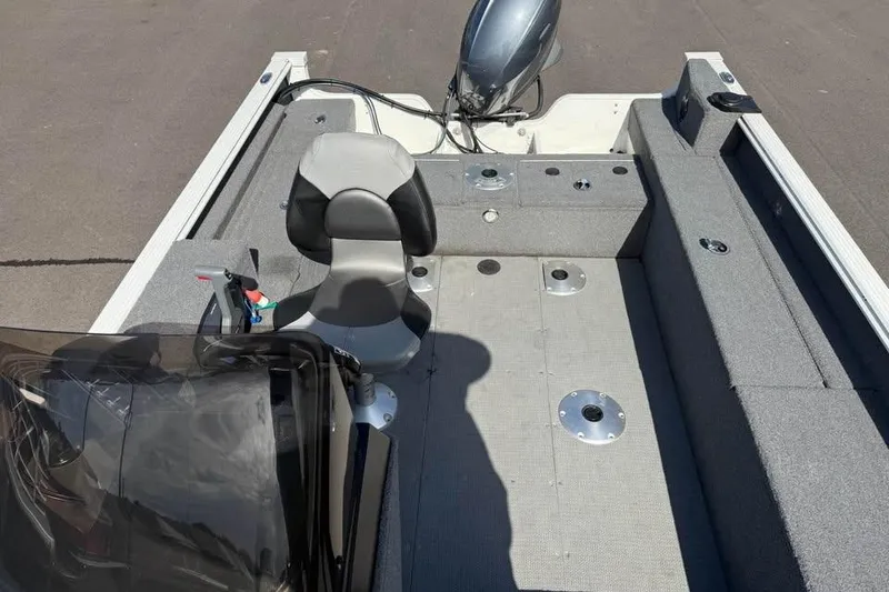 Slide: The Image of 2022 G3 Angler V164 C boat interior with seating and motor, showcasing fishing setup. - 7