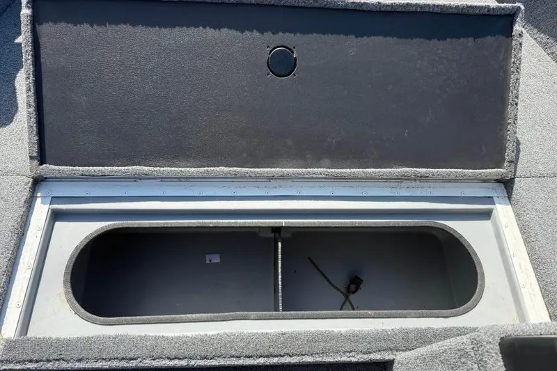 Slide: The Image of 2022 G3 Angler V164 C boat storage compartment, open and empty. - 9