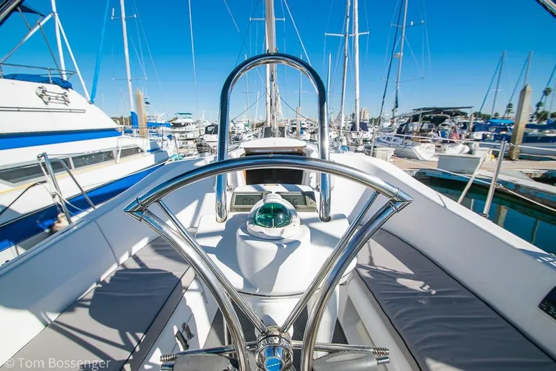 Slide: The Image of Steering wheel of a 2008 Hunter 31 sailboat in a marina. - 22