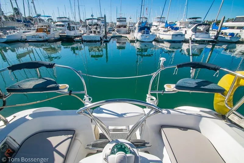 Slide: The Image of Cockpit view of a 2008 Hunter 31 sailboat docked in a marina. - 23