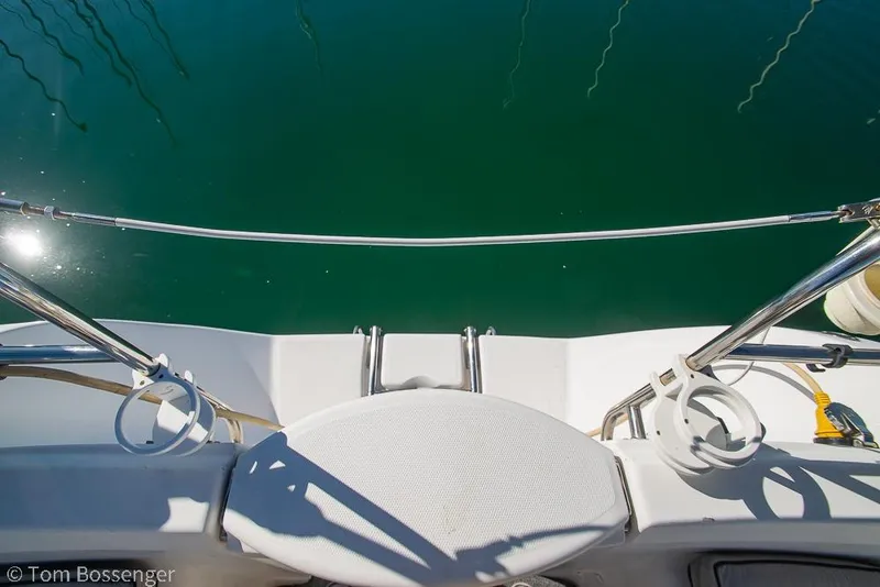 Slide: The Image of View from the deck of a 2008 Hunter 31 sailboat, overlooking calm green water. - 26