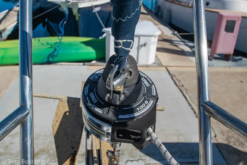 Slide: The Image of Furler mechanism on a 2008 Hunter 31 sailboat, docked with visible green kayak. - 32