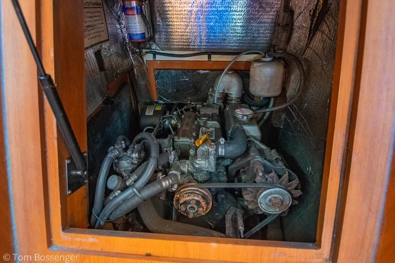 Slide: The Image of Engine compartment of a 2008 Hunter 31 sailboat, showcasing mechanical components. - 36