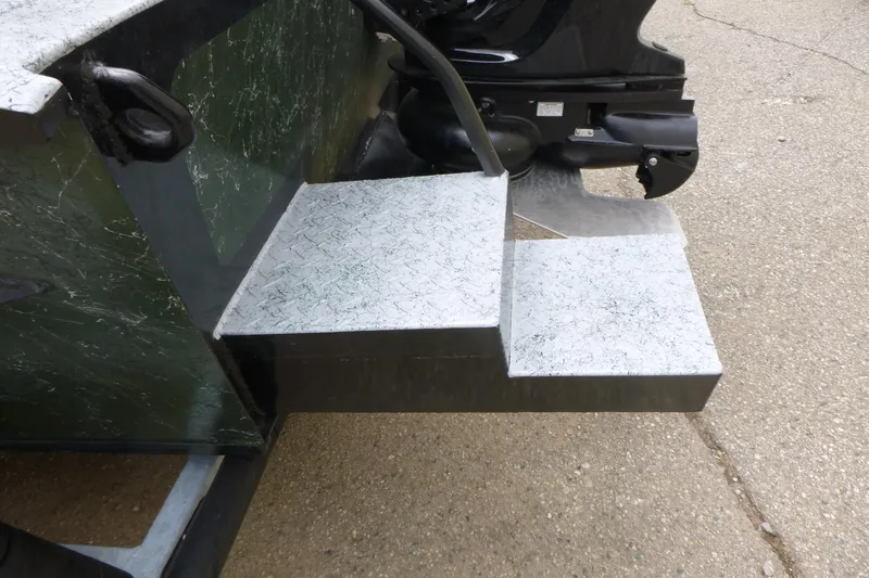 Slide: The Image of StealthCraft 16 StealthWeld 2025 boat with metal steps and motor detail. - 12