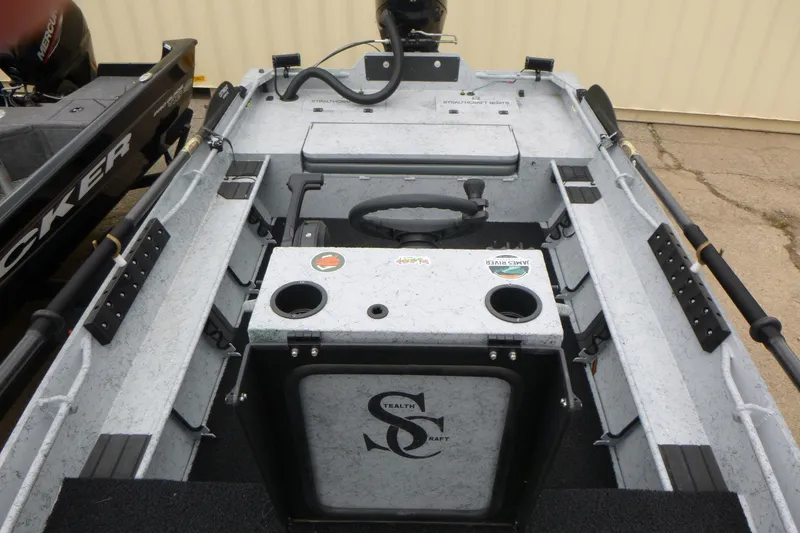 Slide: The Image of 2025 StealthCraft 16 StealthWeld boat interior with steering console and storage compartments. - 5