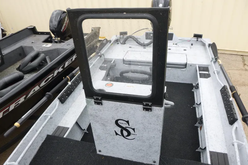 Slide: The Image of 2025 StealthCraft 16 StealthWeld boat interior with steering console and seating. - 6