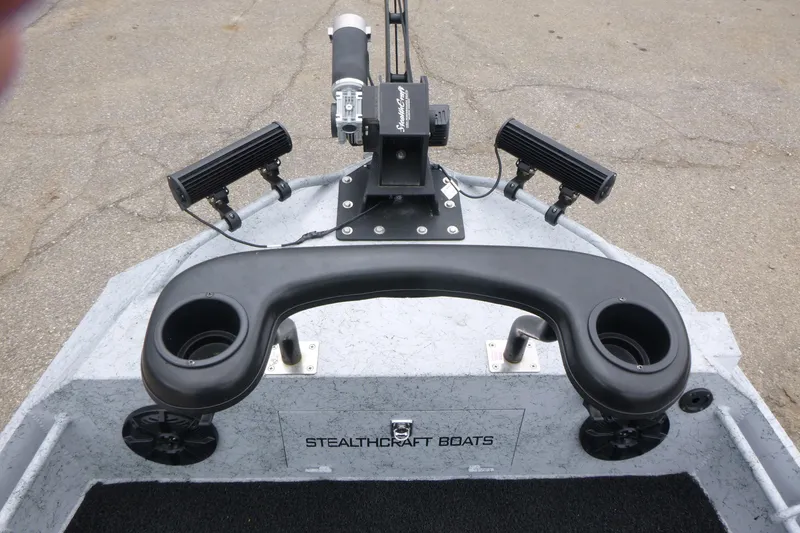 Slide: The Image of 2025 StealthCraft 16 StealthWeld boat with rod holders and steering console. - 7