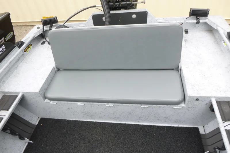 Slide: The Image of 2025 StealthCraft 16 StealthWeld boat interior with gray cushioned seating. - 9