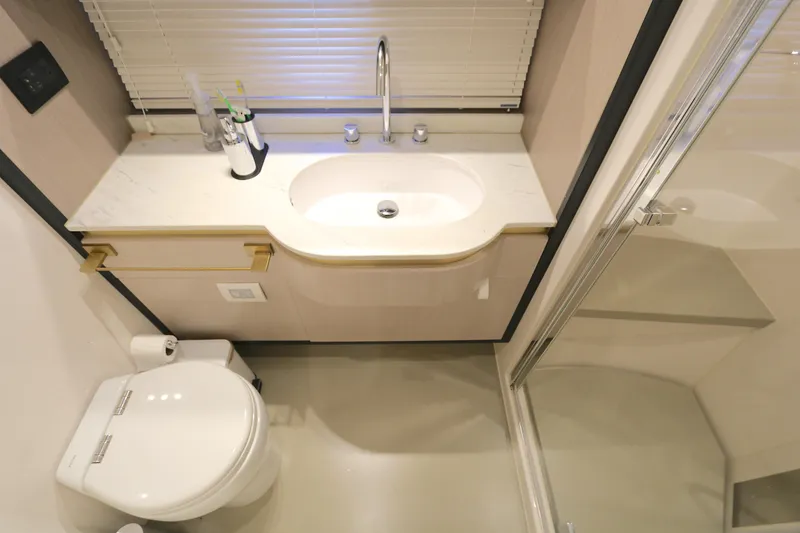 Slide: The Image of Luxurious bathroom in 2020 Azimut 55 yacht with modern fixtures and elegant design. - 10