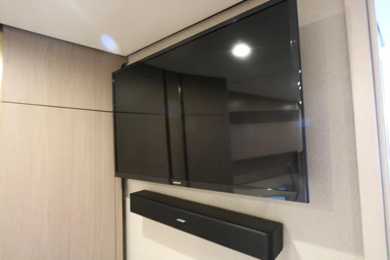 Slide: The Image of Flat-screen TV and soundbar in 2020 Azimut 55 yacht interior. - 12