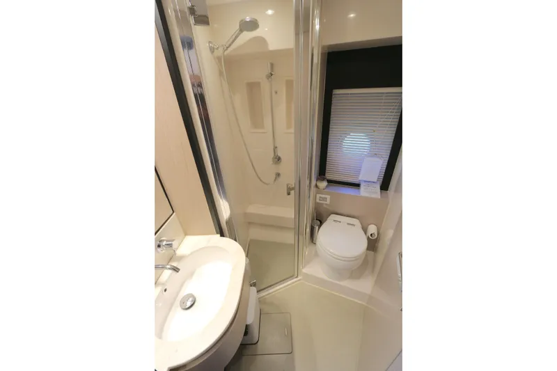 Slide: The Image of Luxurious bathroom in 2020 Azimut 55 yacht with shower, sink, and toilet. - 13