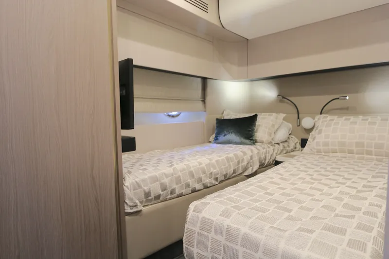 Slide: The Image of Luxurious cabin interior of 2020 Azimut 55 yacht with twin beds and modern decor. - 14