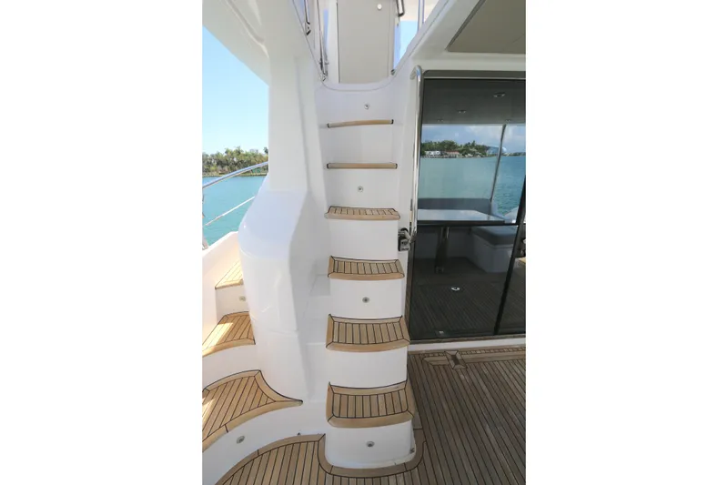 Slide: The Image of Staircase on 2020 Azimut 55 yacht with teak steps and ocean view. - 18