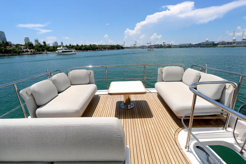 Slide: The Image of Luxurious 2020 Azimut 55 yacht deck with comfortable seating and scenic waterfront view. - 22